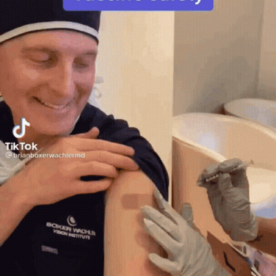 Man Smiling Getting Vaccine At Boxer Wache Vision Institute GIF