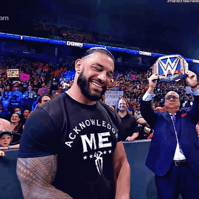 Man Smiling In Acknowledge Me Shirt GIF