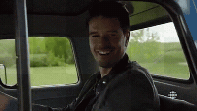 Man Smiling In Back Seat Of Car GIF