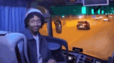 Man Smiling In Bus Driver's Seat GIF