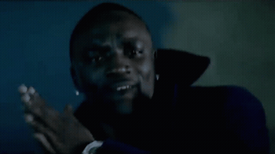 Man Smiling In Dark Room GIF