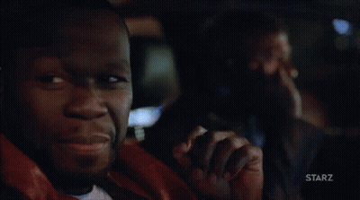Man Smiling In Dark Room With Starz Logo GIF