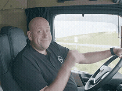 Man Smiling In Driver Seat Holding Steering Wheel GIF