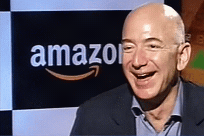Man Smiling In Front Of Amazon Sign GIF