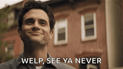 Man Smiling In Front Of Brick Building GIF