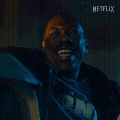 Man Smiling In Front Of Brick Wall Netflix GIF