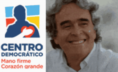 Man Smiling In Front Of Centro Democrático Logo GIF