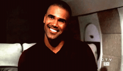 Man Smiling In Front Of CTV Sign GIF