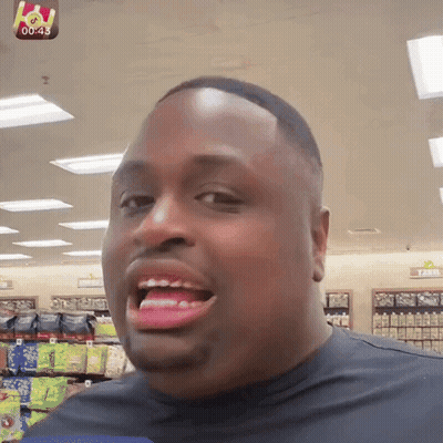 Man Smiling In Front Of Farm Sign GIF