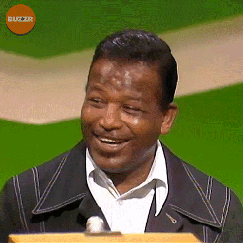 Man Smiling In Front Of Microphone With Buzzr GIF