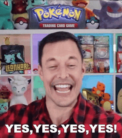 Man Smiling In Front Of Pokemon Trading Card Game Shelf GIF