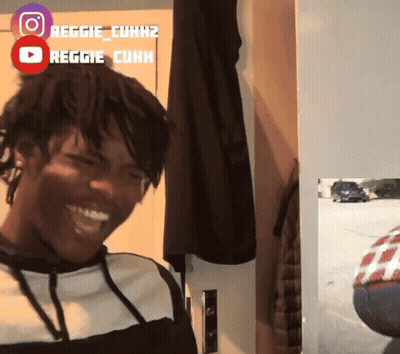 Man Smiling In Front Of Reggie Cuhk Sign GIF