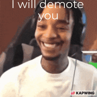 Man Smiling In Front Of Screen Saying I Will Demote You GIF