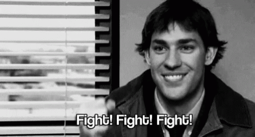 Man Smiling In Front Of Window Saying Fight Fight Fight GIF