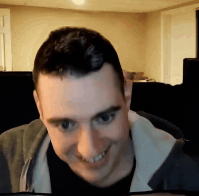 Man Smiling In Grey Jacket GIF