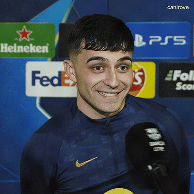 Man Smiling In Nike Shirt In Front Of FedEx Sign GIF