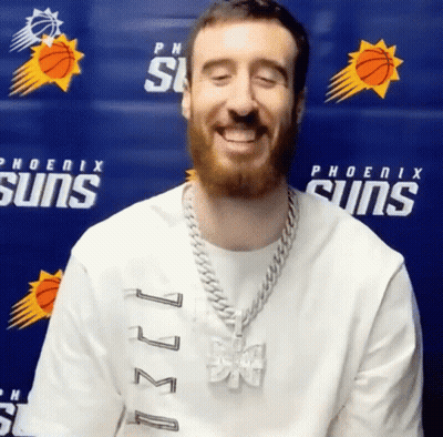 Man Smiling In Phoenix Suns Shirt Blue Wall GIF