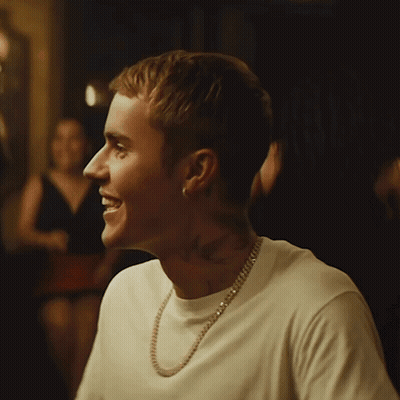Man Smiling In White T-Shirt And Gold Chain GIF