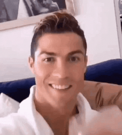 Man Smiling On Couch GIF