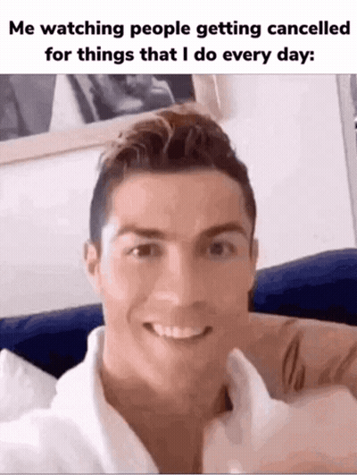 Man Smiling On Couch Looking At Camera GIF