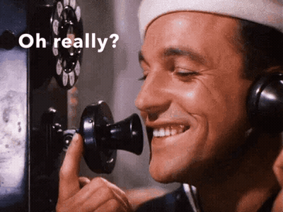 Man Smiling On Phone Saying Oh Really GIF