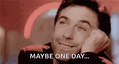 Man Smiling Resting Head On Hand GIF