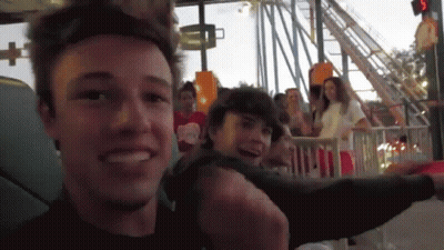 Man Smiling Riding Roller Coaster GIF