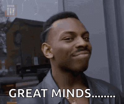 Man Smiling Saying Great Minds GIF