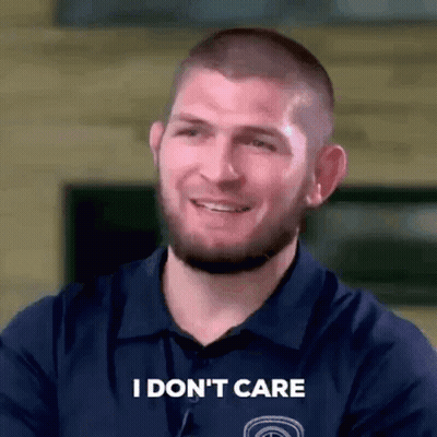 Man Smiling Saying I Don't Care GIF
