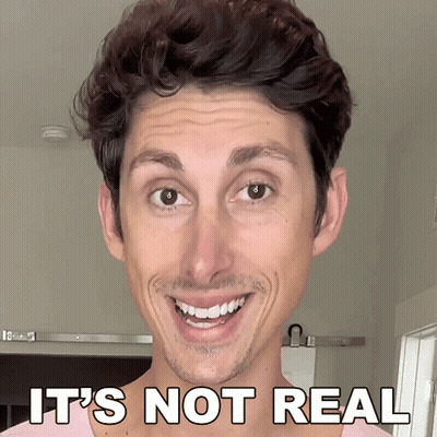 Man Smiling Saying It's Not Real GIF
