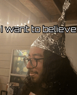 Man Smiling Wearing Tin Hat GIF