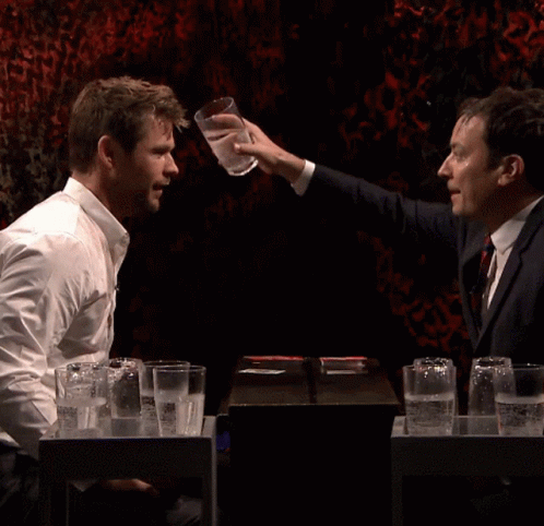 Man Smiling While Water Is Poured GIF