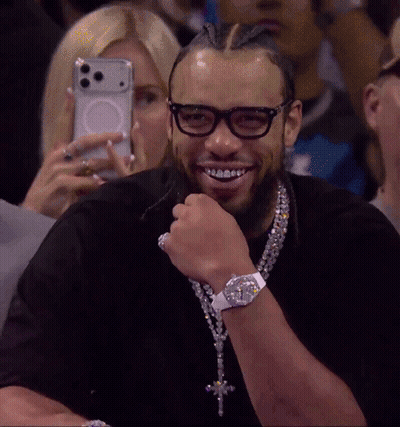 Man Smiling While Woman Takes Photo GIF
