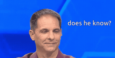 Man Smiling With Does He Know Text GIF