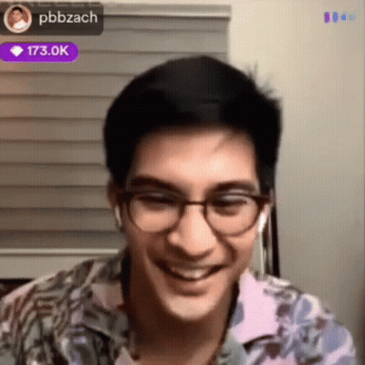 Man Smiling With Glasses And Earbuds GIF