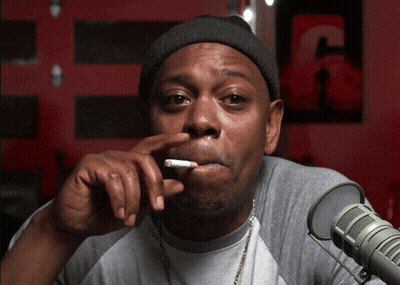 Man Smoking At Microphone With Letter C GIF