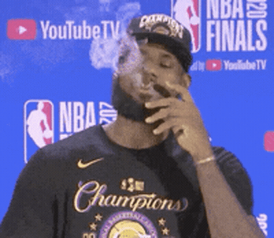 Man Smoking Cigar At YouTube TV Sign GIF