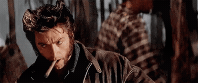 Man Smoking Cigar In Forest GIF