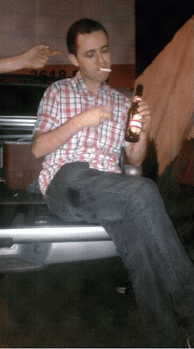Man Smoking Cigarette Holding Beer GIF