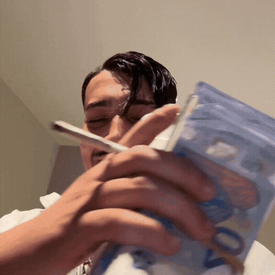 Man Smoking Cigarette Holding Stack Of 20 Euro Notes GIF