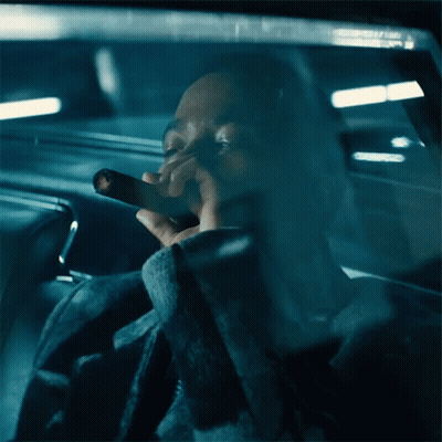Man Smoking Cigarette In Car With Eyes Closed GIF