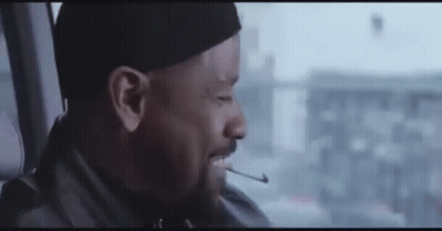 Man Smoking Cigarette In Car With Hat GIF