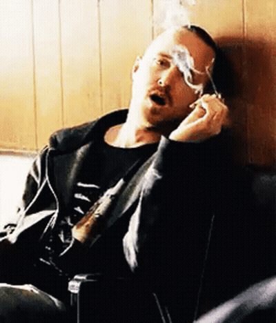 Man Smoking Cigarette In Chair GIF