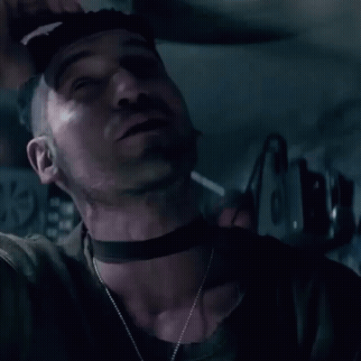 Man Smoking Cigarette In Dark Room GIF
