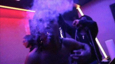 Man Smoking Cigarette In Dark Room With Smoke GIF
