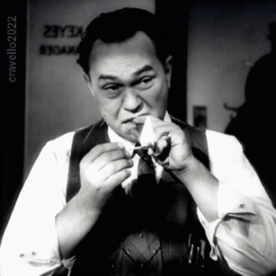 Man Smoking Cigarette In Front Of Cravello20202 Sign GIF