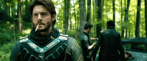 Man Smoking Cigarette In Woods GIF