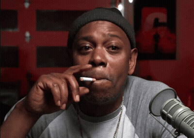 Man Smoking Cigarette Near Microphone With Letter C GIF