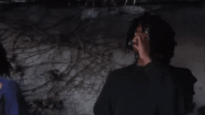 Man Smoking Cigarette Next To Martin Cup GIF