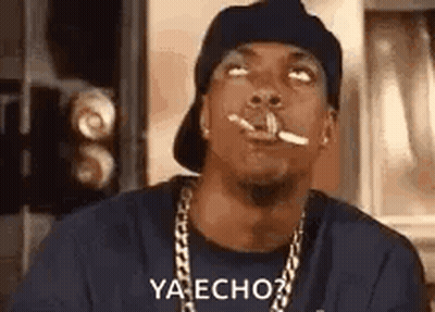 Man Smoking Cigarette Wearing Hat And Chain GIF